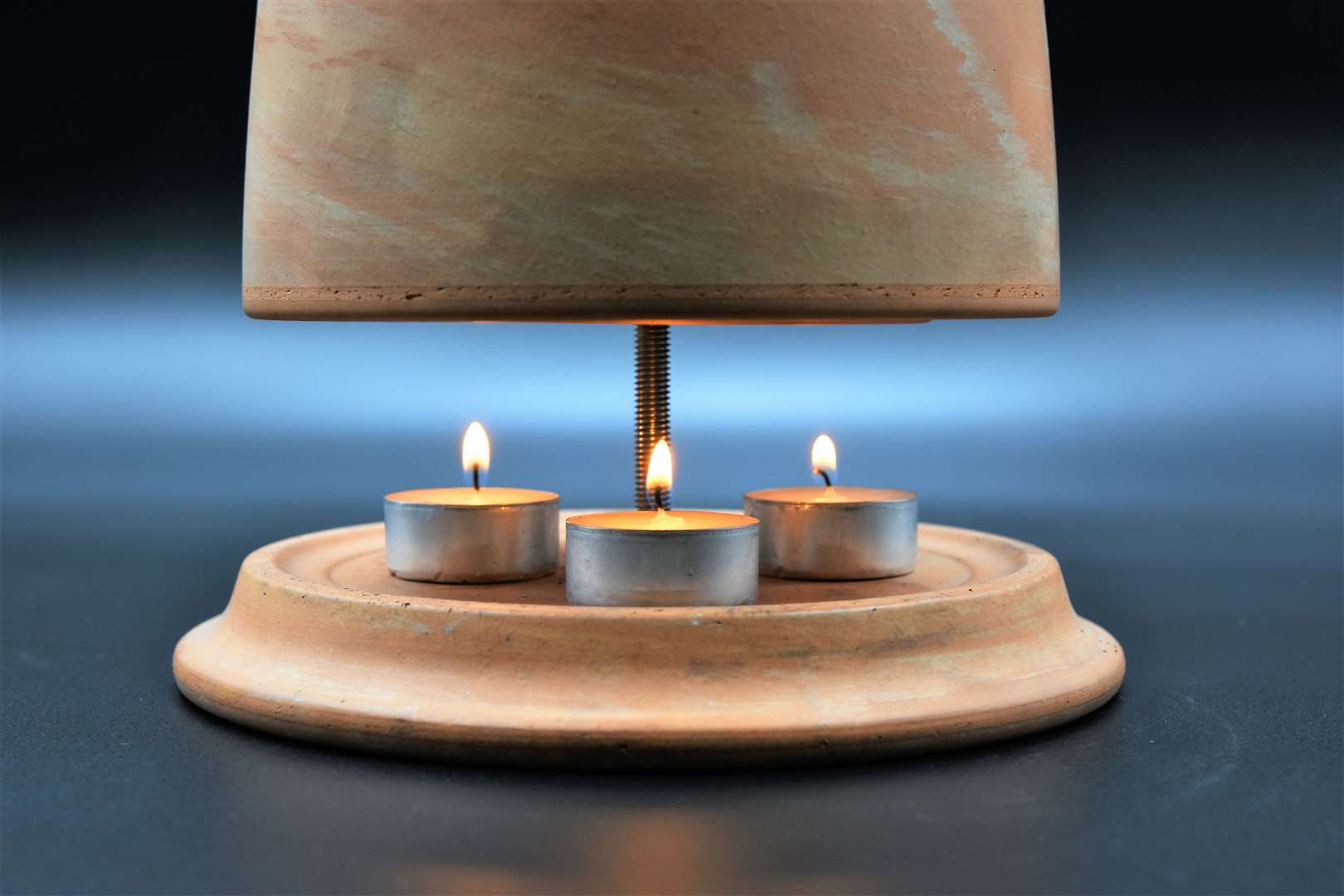 One heating hack involves tealights and a terracotta pot. Picture: Adobe Stock