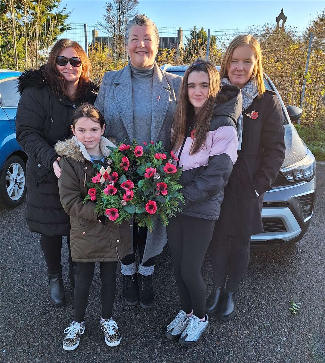 Debbie Jappy (front left) and Sophie Macleod-Sinclair laid a wreath on behalf of Brora Primary School and Nursery. They were accompanied by school staff members, back from left, Ruth Macleod, Gina Rankin and head teacher Mairi Scott.