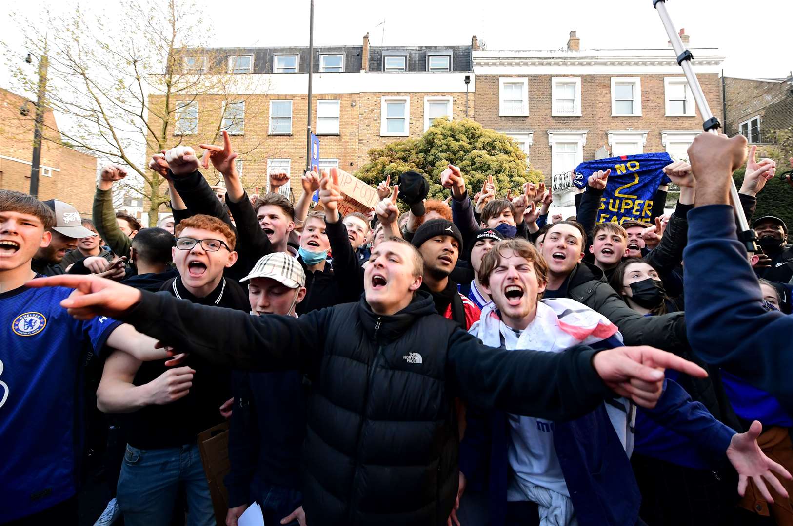 Fans outside Stamford Bridge react to the potential news that Chelsea are preparing to withdraw from the European Super League (Ian West/PA)