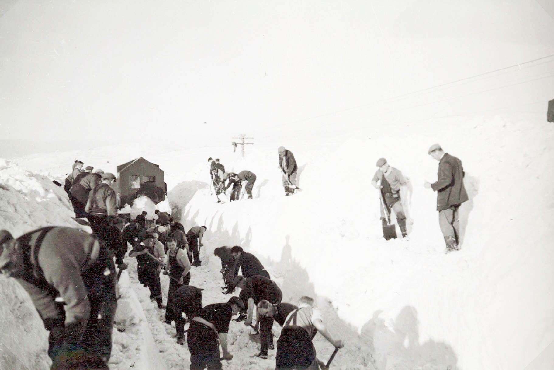 Railway workers clearing snow along the line by hand. Picture: Highland Railway Society/Am Baile