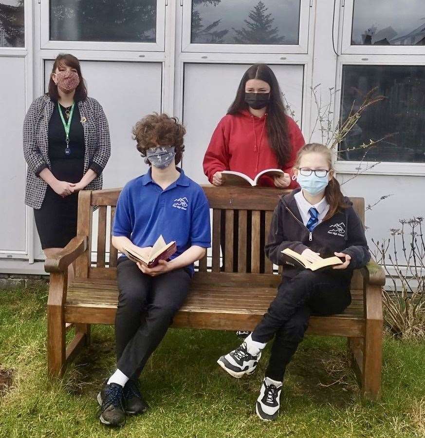 History teacher Emma Cooper and one of her students stand behind pupils Donovan Easthope and Zhade Mackay. All three students are taking part in the Dundan project.