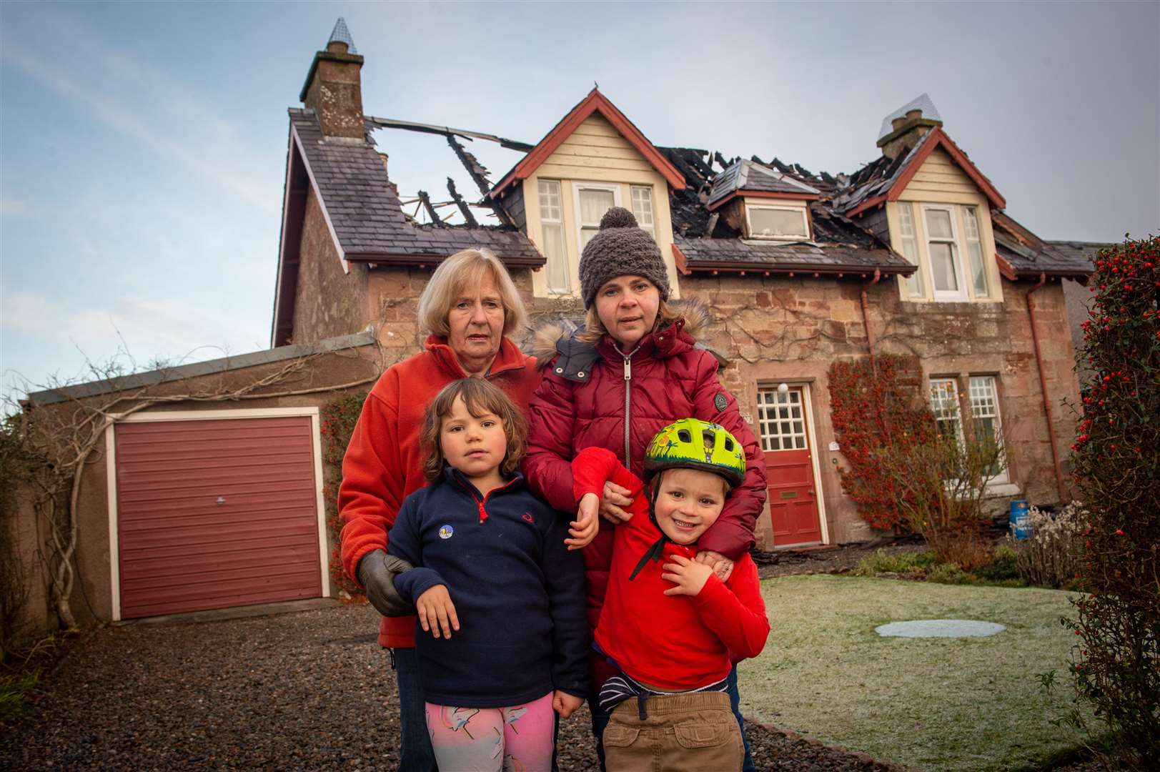 Lois MacDonell, Penelope MacDonell, (front) Vivienne DeJesus and Mark DeJesus were grateful for community support after the fire and the role alarms played in alerting them to the danger. Picture: Callum Mackay