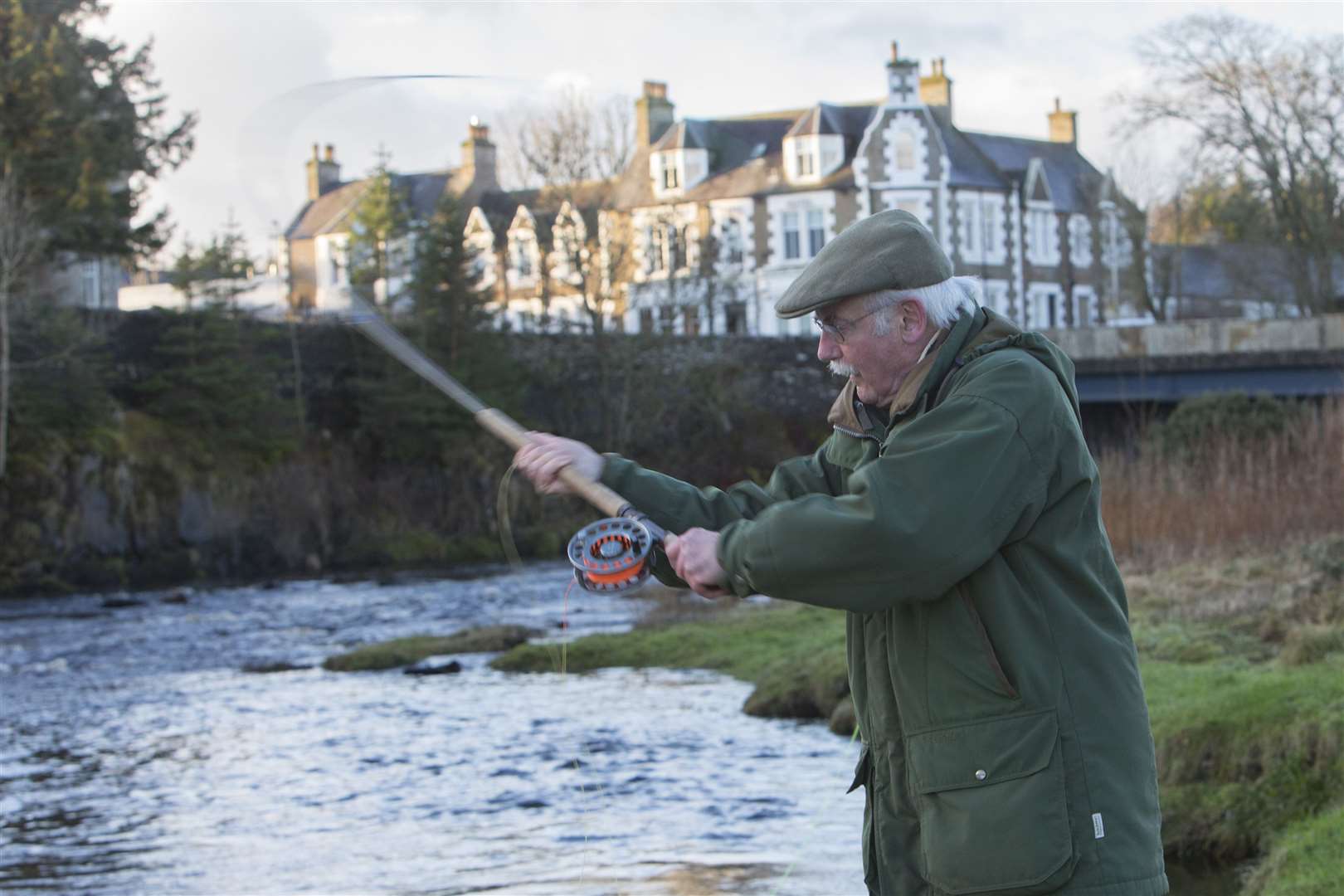 Retired lawyer Francis Sandison, from Carlisle, casting the first fly of the 2023 season on the River Thurso. Picture: Robert MacDonald / Northern Studios