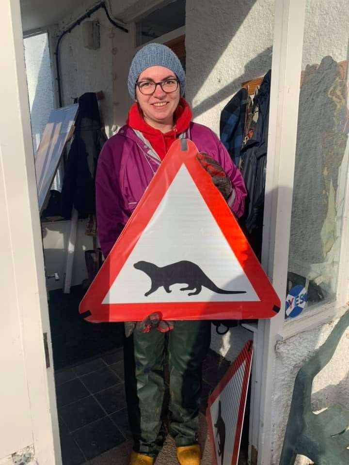 Wildlife supporter Lucy Beattie of Leckmelm with one of the signs before it was erected.