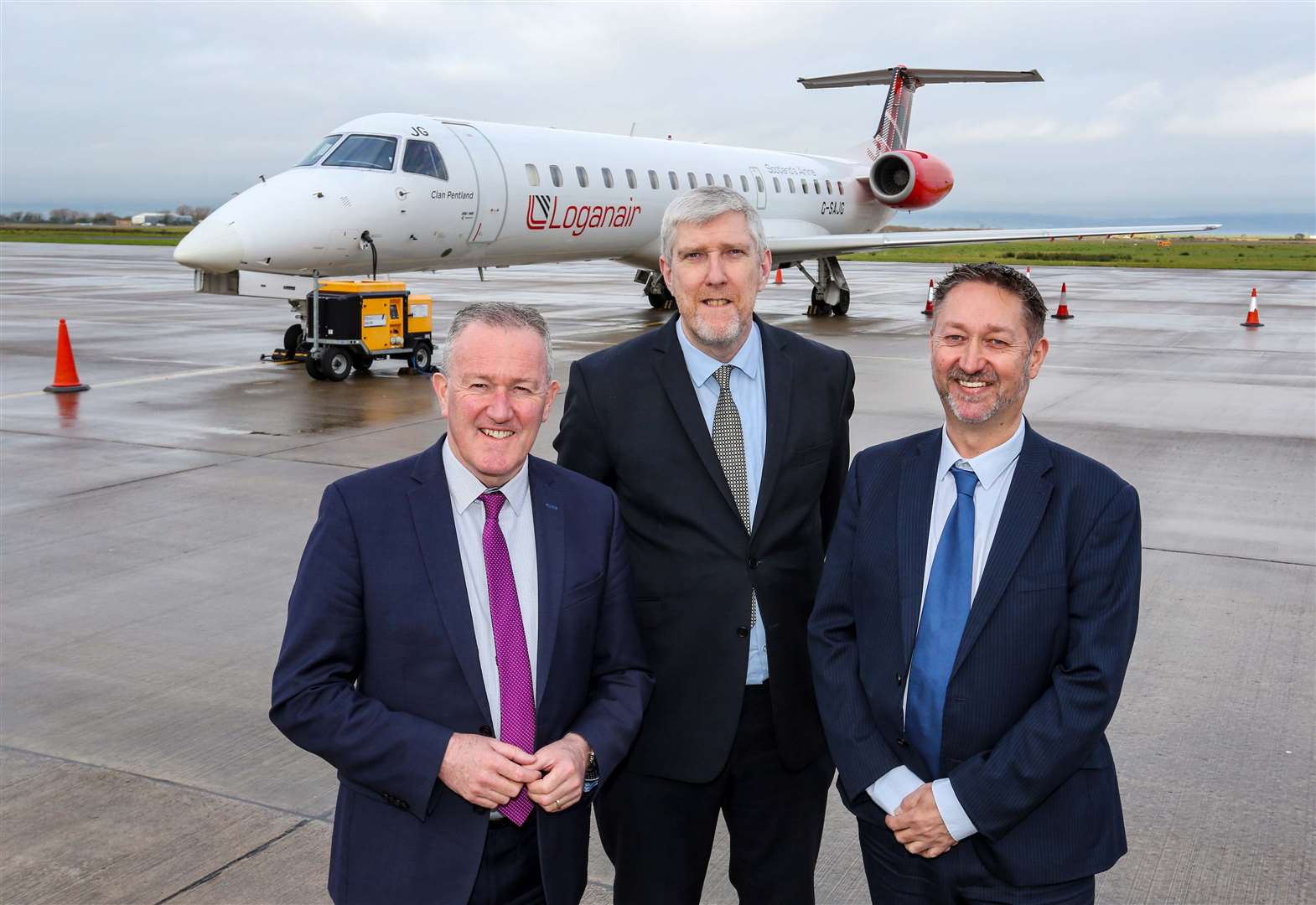 Economy Minister Conor Murphy and Infrastructure Minister John O’Dowd with Steve Frazer, managing director of City of Derry Airport, at the funding announcement (Lorcan Doherty/PA)