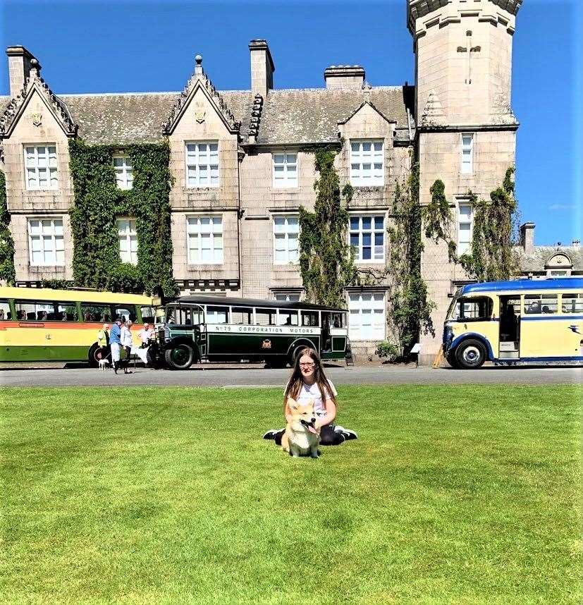 Eevie and Bagel in front of Balmoral Castle.