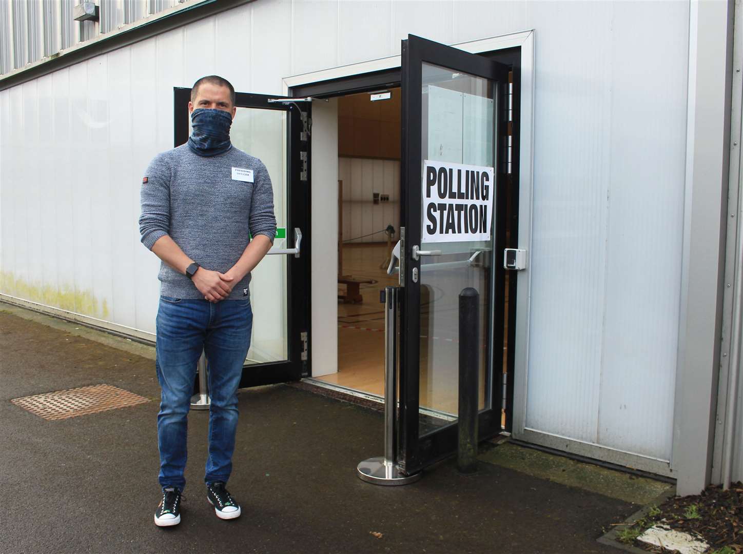 Presiding officer Luke Merchant outside the polling station at Noss Primary School in Wick shortly after voting began at 7am today.