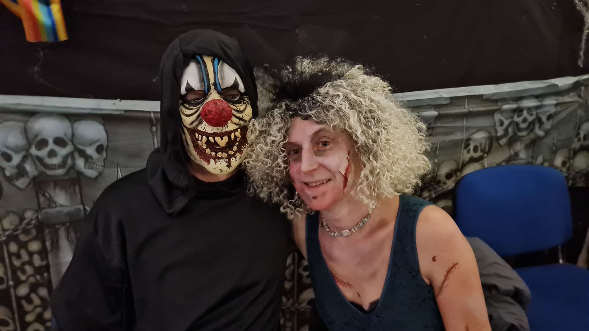 You wouldn't want to meet them on a dark night. Steve Holmes donned a monster face to go to the dance and Susan Holmes painted scars on her body.