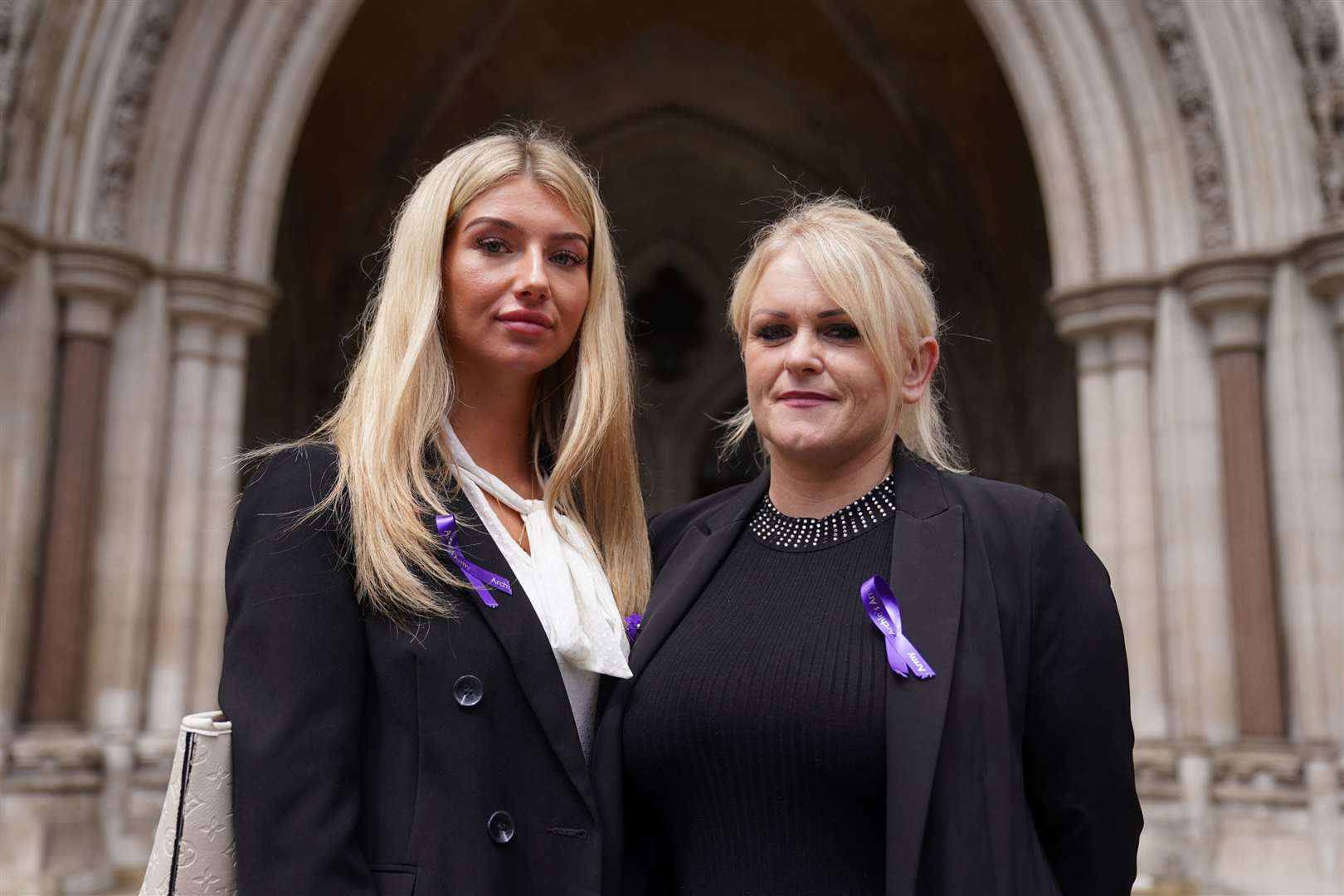 Archie Battersbee’s mother Hollie Dance (right) and family friend Ella Carter, outside the High Court in London (Kirsty O’Connor/PA)