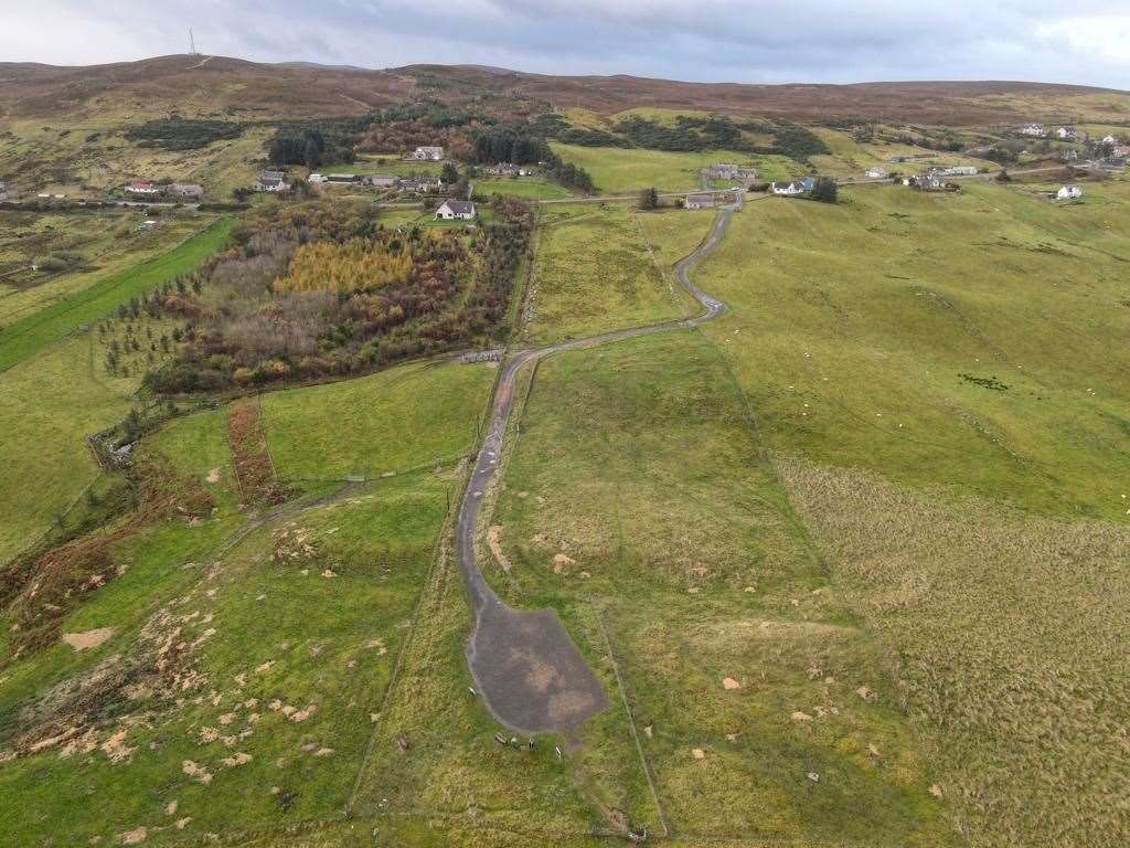 This drone image clearly shows the track off the A836 to Melvich beach with the car park in the foreground.