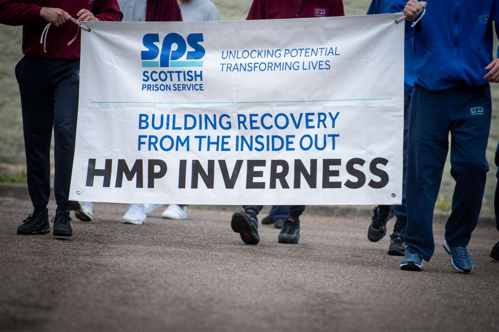 Prisoners carry the recovery flag. Picture: Callum Mackay..
