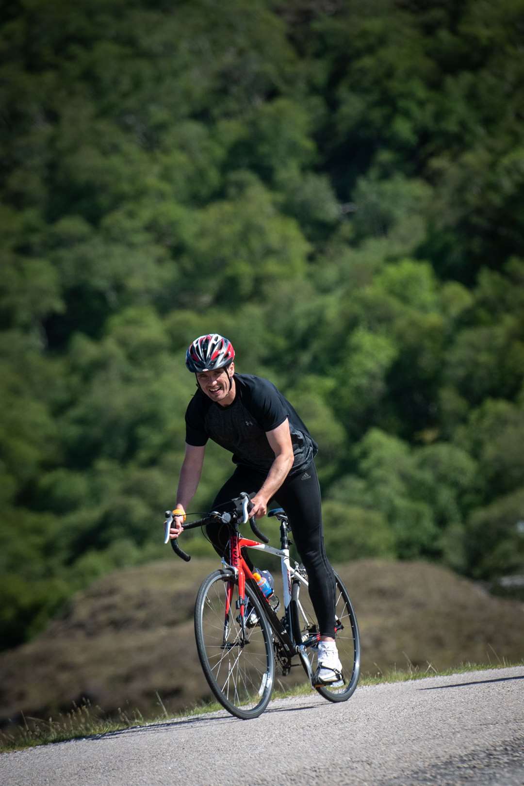 Steven Mackay riding through the pain barrier, after damaging his Achilles tendon the day before, on a tough section between Kylesku and Clashnessie. Picture: Callum Mackay