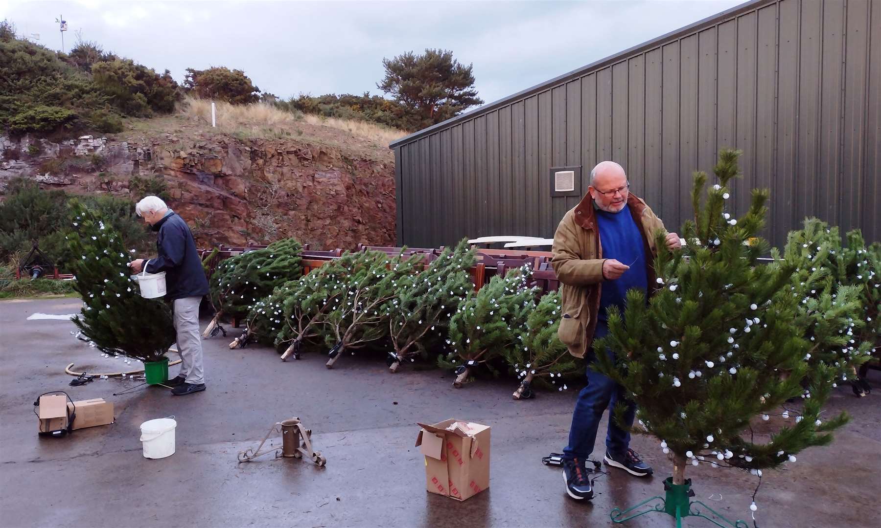 Volunteer Mark Fraser (right) and Dornoch Community Council chairman Paddy Murray prepare Christmas trees to put up in the town.