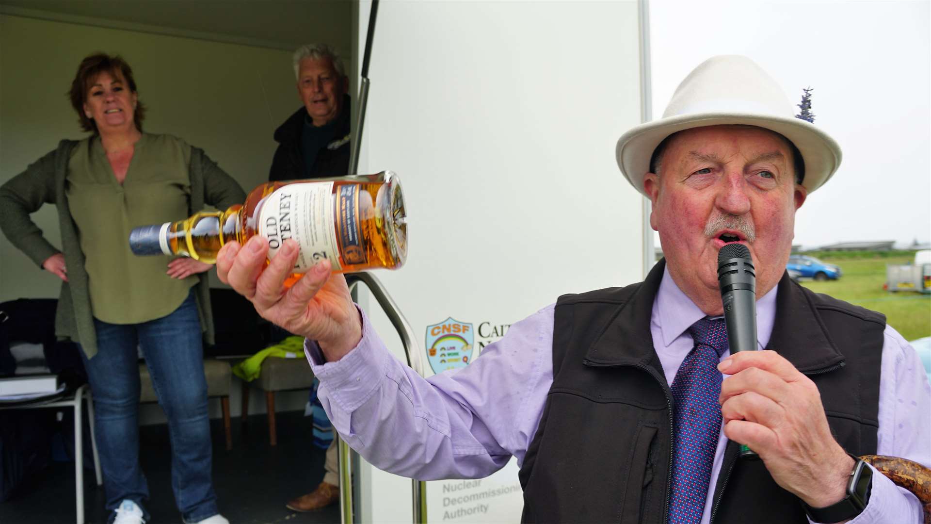 Willie Mackay was gifted whisky for his compering work on the day. He joked that the best before date was the next day so he would have to polish the bottle off that night. Picture: DGS