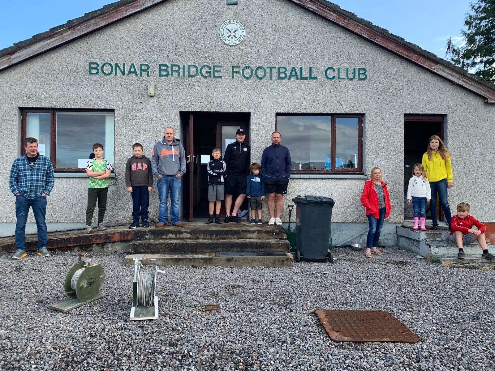 Bonar Bridge Football Club juniors and committee members outside the clubhouse pre-lockdown.