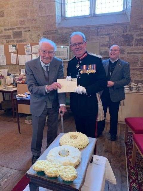 Sutherland Lord Lieutenant of Sutherland Patrick Marriott presented Eric Dawson with his 100th birthday card from the King Charles III and Queen Consort Camilla.