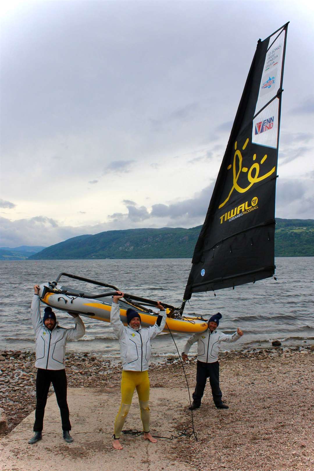 The crew with one of their Tiwal sailboats.