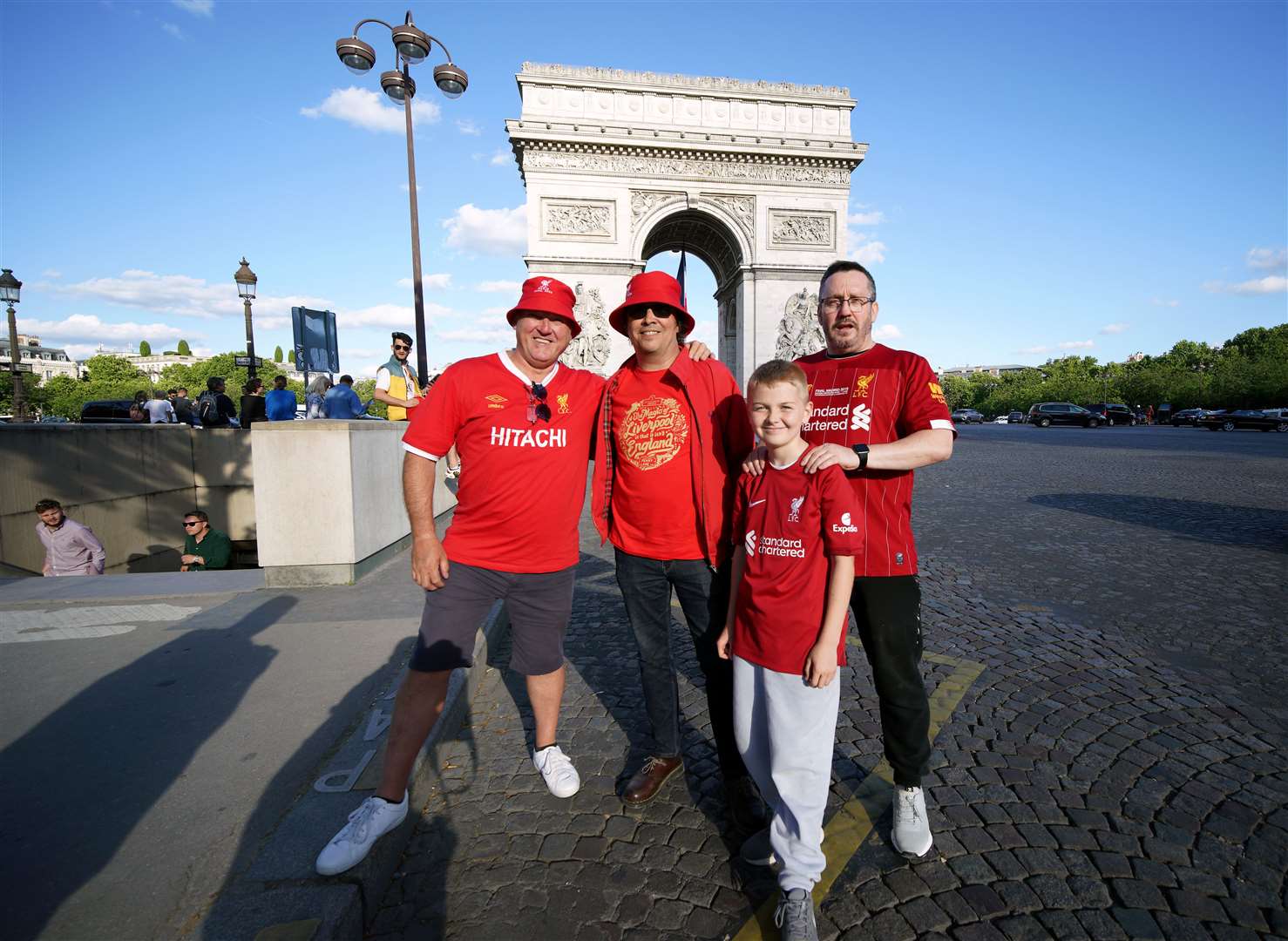 Fans pose in front of Paris landmarks (Peter Byrne/PA)
