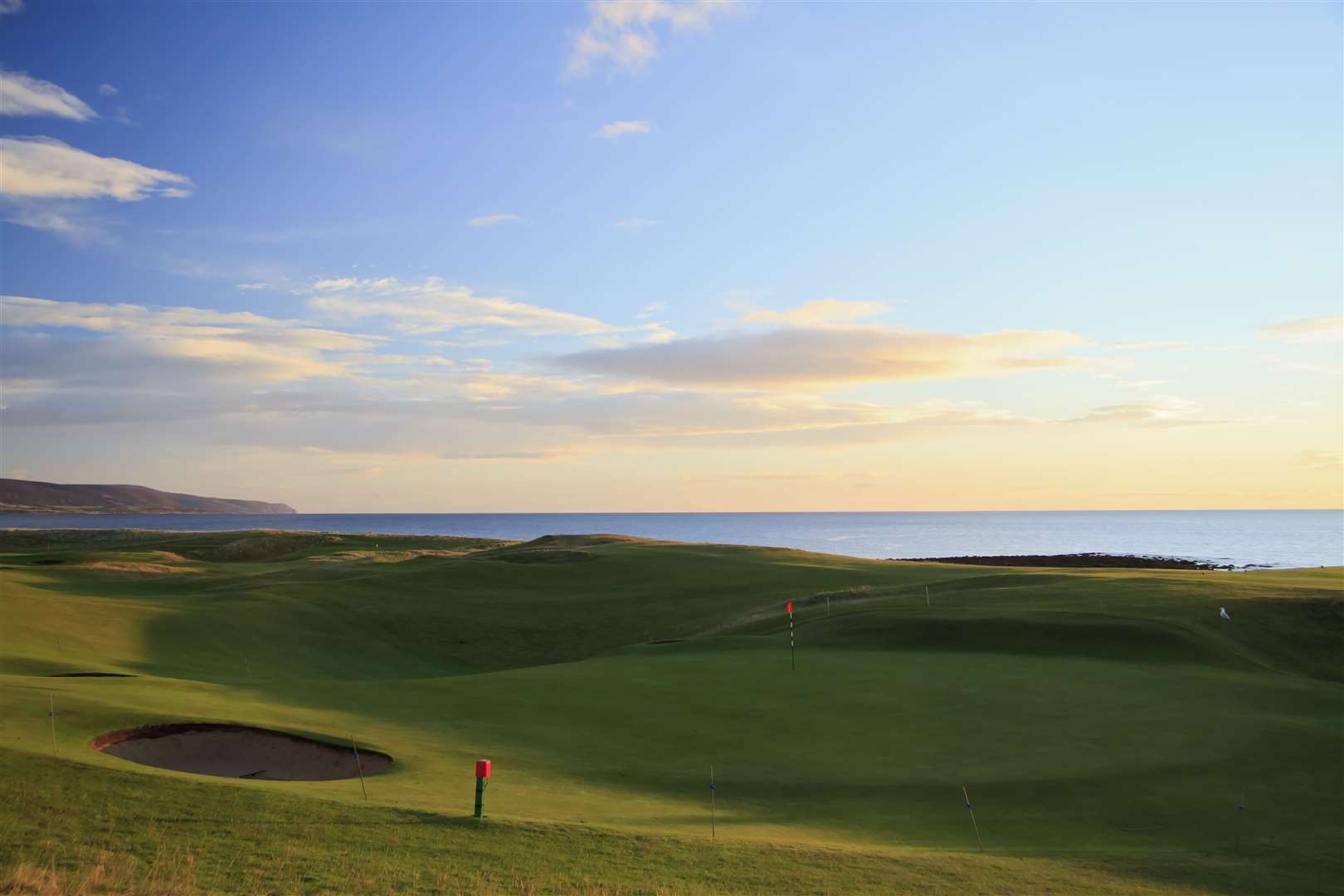 The 18th green and 1st hole at Brora Golf Course.