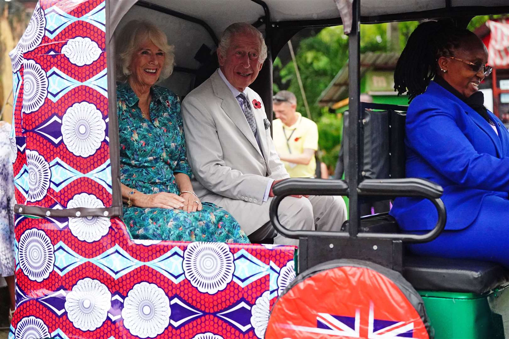 The King and Queen in a tuk-tuk at Fort Jesus, in Mombasa Old Town (Victoria Jones/PA)