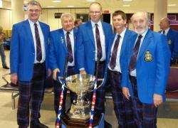 Richard Mackenzie (second right) with the Strathcona Cup which he helped win as part of the Scotland team.