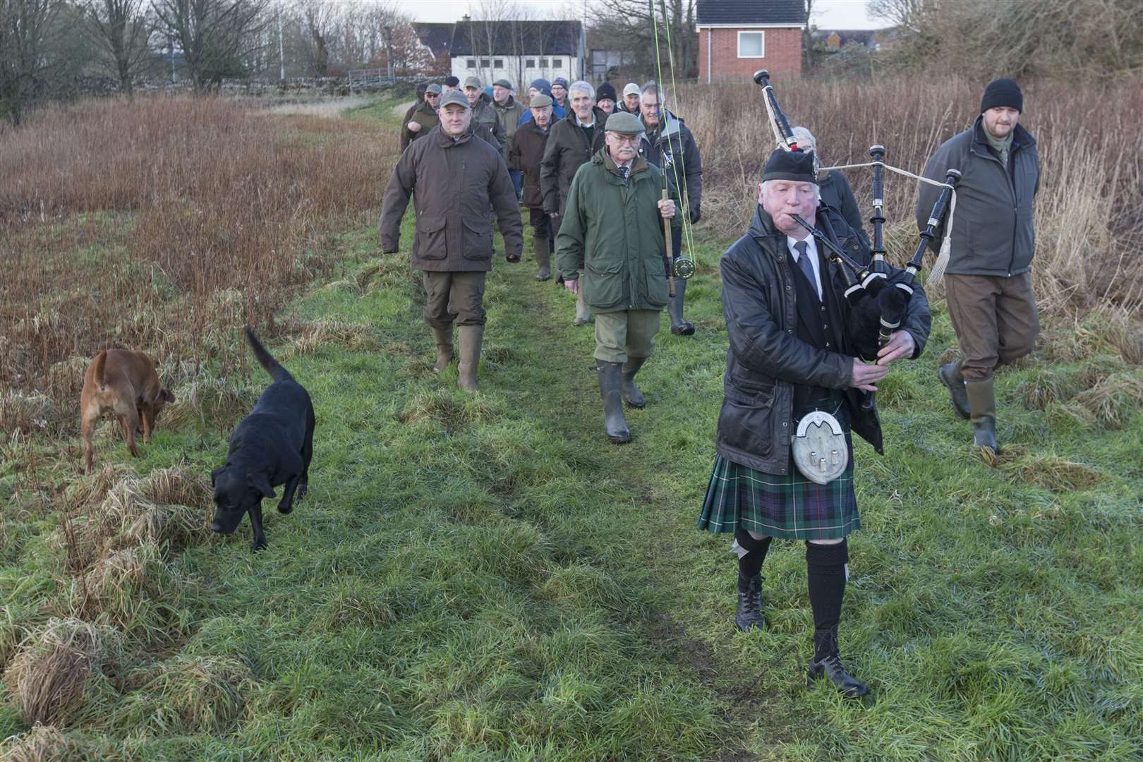 Piper Alasdair Miller leads the anglers along the river bank for the ceremony marking the start of the 2023 season. Picture: Robert MacDonald / Northern Studios