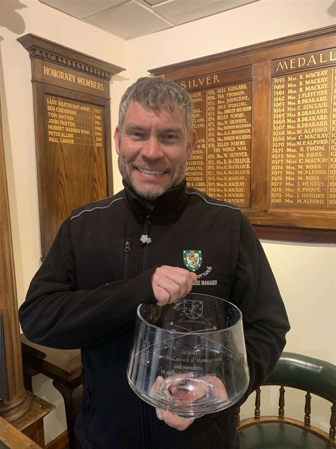 Deputy course manager Scott "Scoosh" Aitchison has been presented with an engraved crystal bowl to mark 25 years of service to Royal Dornoch Golf Club.