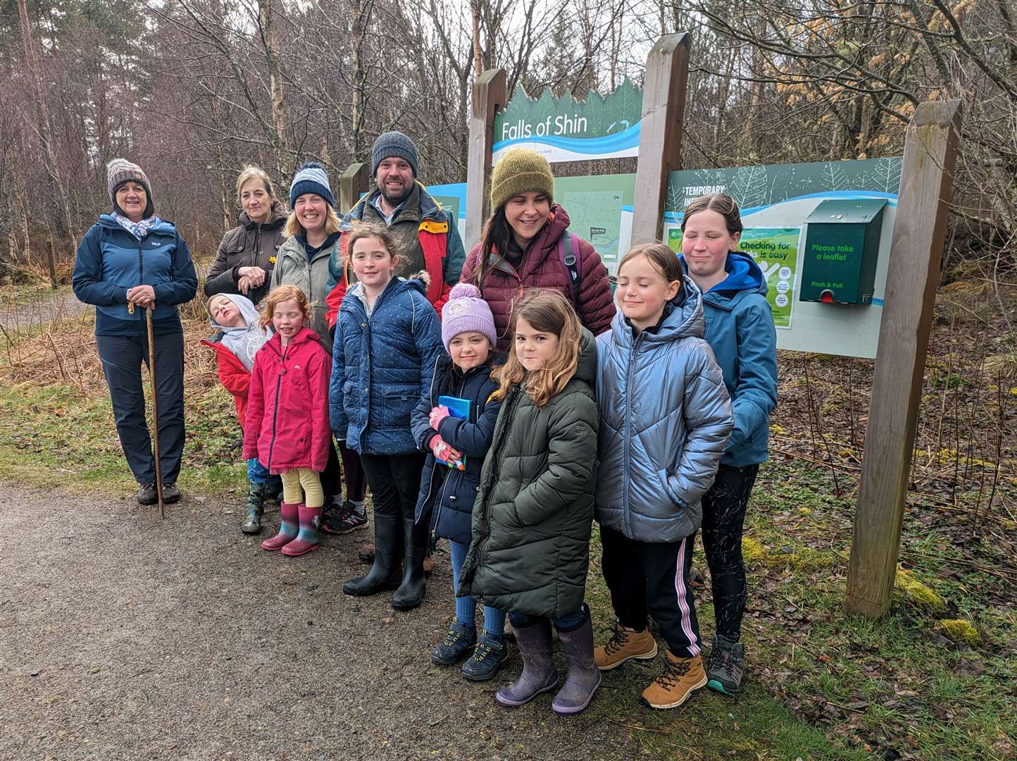 A group of children and adults enjoyed a walk around the pond at Falls of Shin.