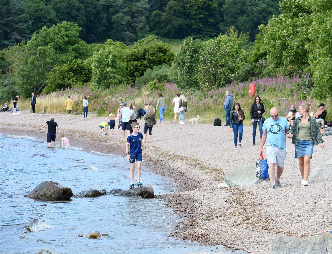 Visitors on Dores beach (file photo). Picture: Gary Anthony.