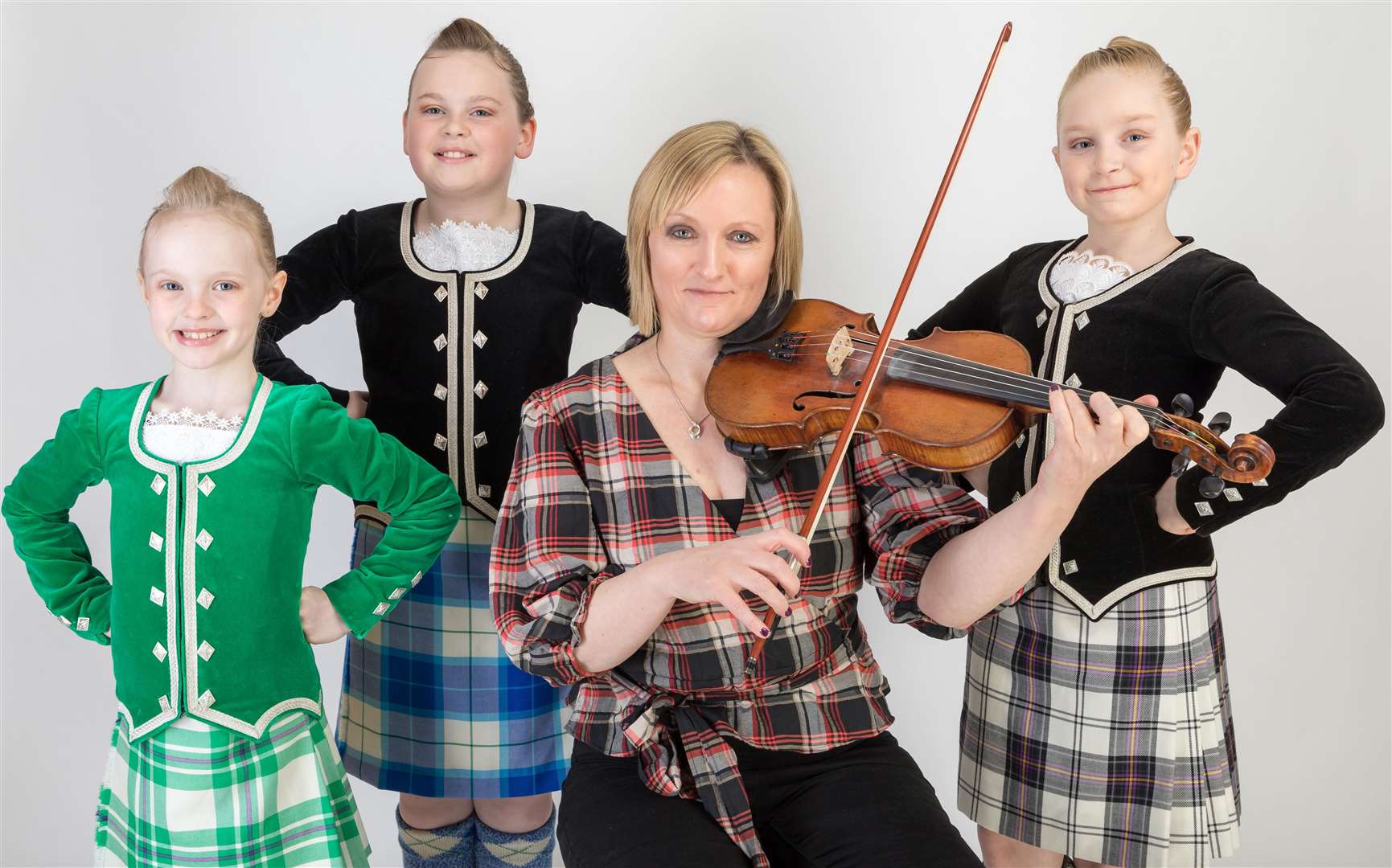Karen Steven with dancers from the Tanya Horne School of Dancing. They are (from left) Eilidh Budge, Halkirk, Chloe Mackay, Halkirk, and Skye McLeod, Thurso. Picture: Duncan McLachlan