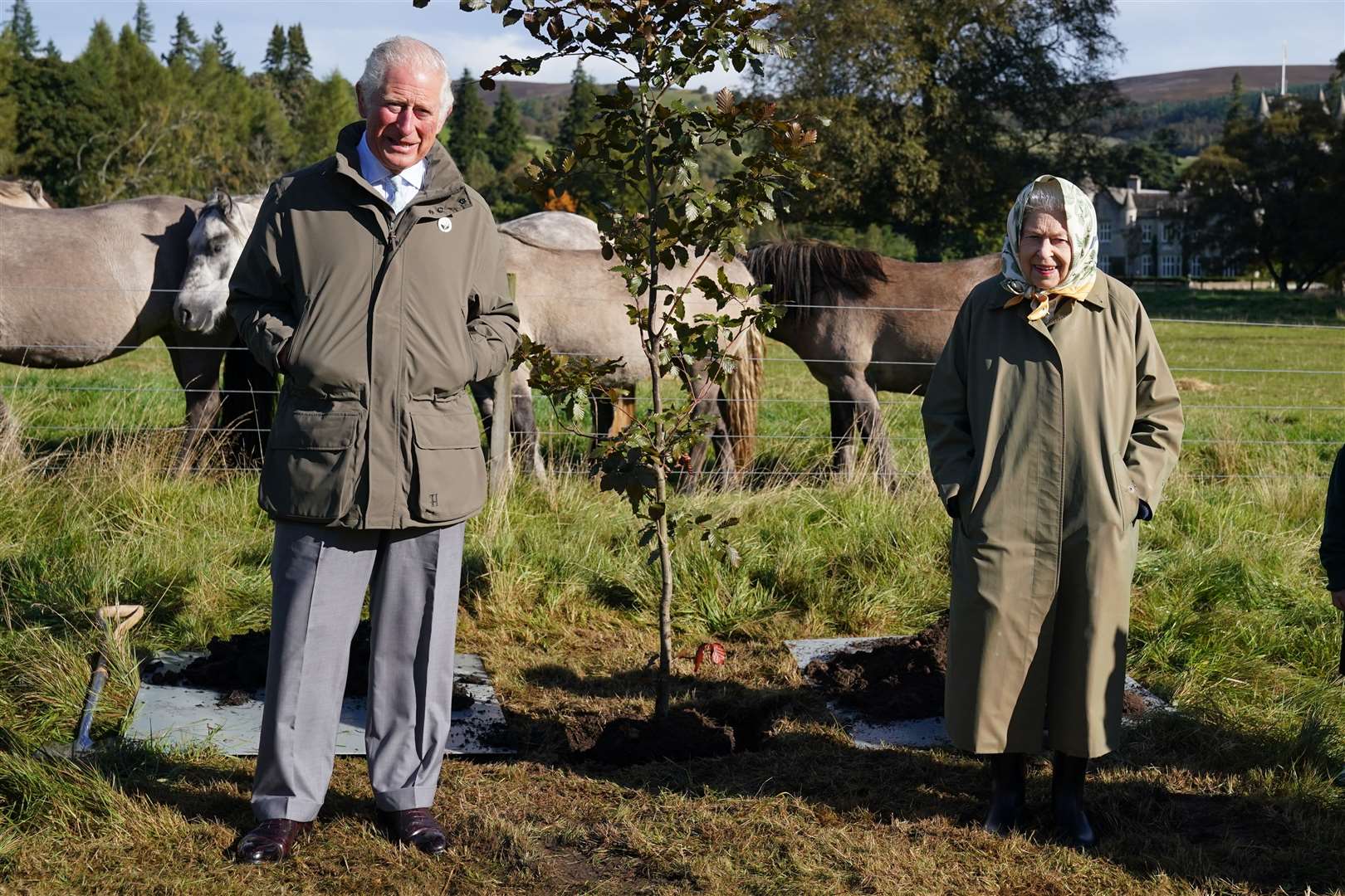 The late Queen Elizabeth II and then Prince of Wales with a tree they planted at the Balmoral Cricket Pavilion to mark the start of the official planting season for the Queen's Green Canopy (QGC) in 2021. Picture: The Queen's Green Canopy.
