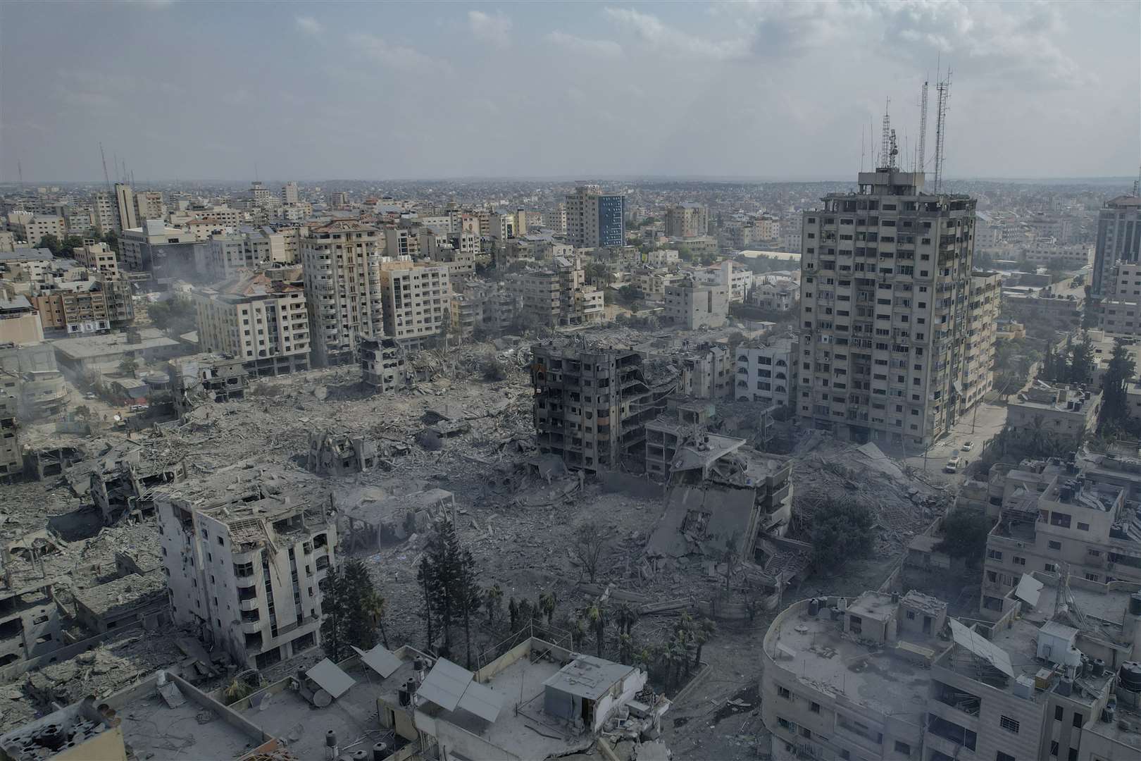 Buildings hit by an Israeli airstrike in Gaza City (Hatem Moussa/AP)