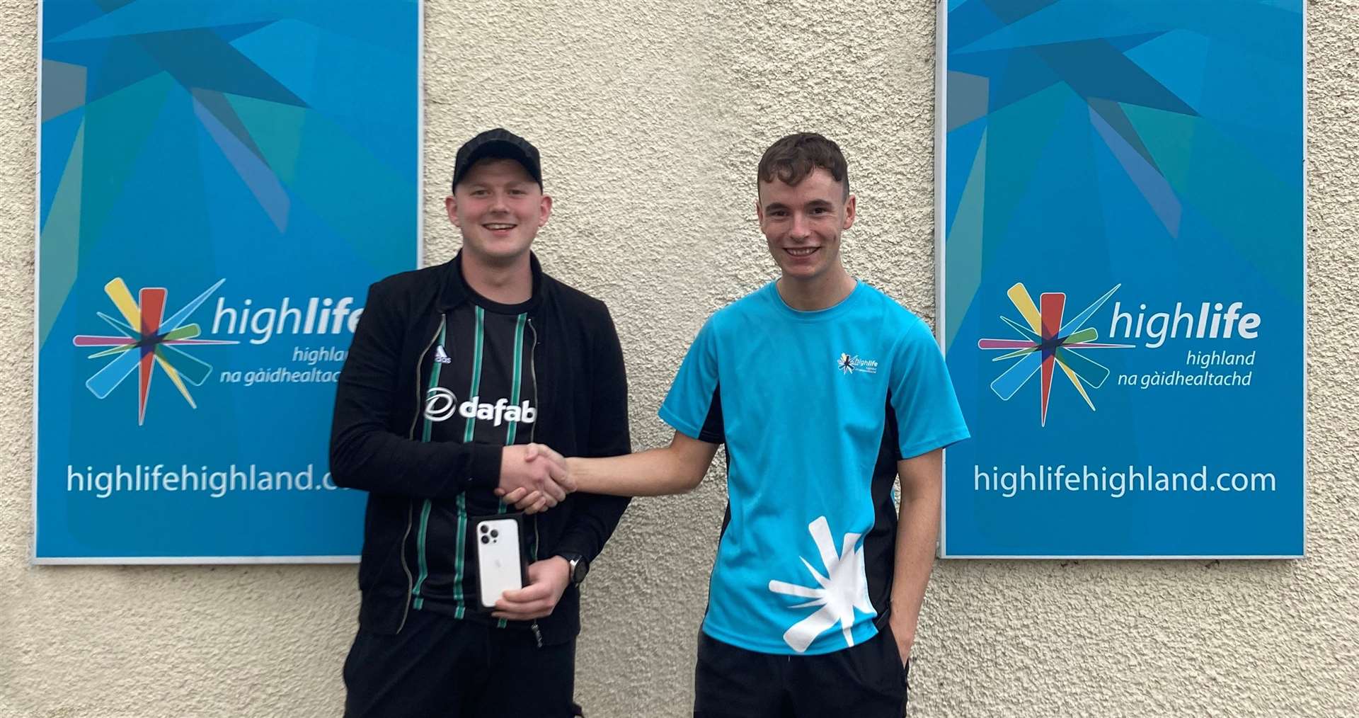 Ryan Renwick (left) was presented with his prize by High Life Highland's Robbie Sutherland.