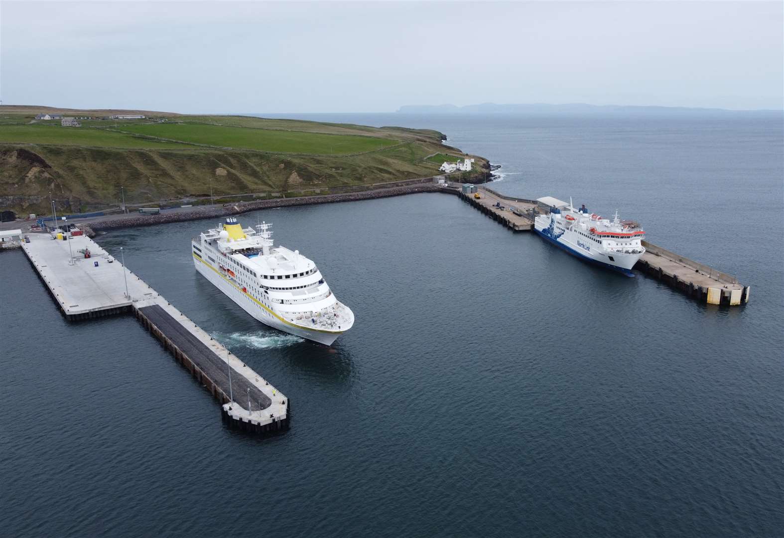 The cruise ship MS Hamburg alongside the NorthLink ferry at Scrabster harbour.