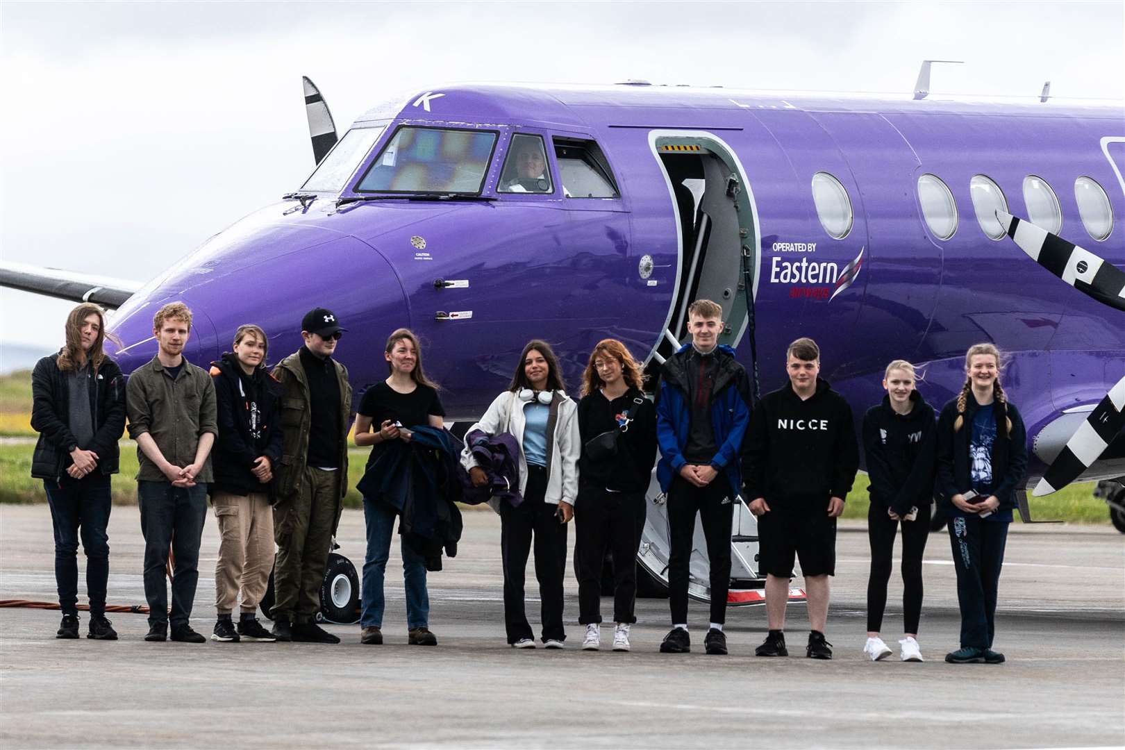 Eleven of the youngsters get ready for the flight to Aberdeen as they set off to meet their boats.