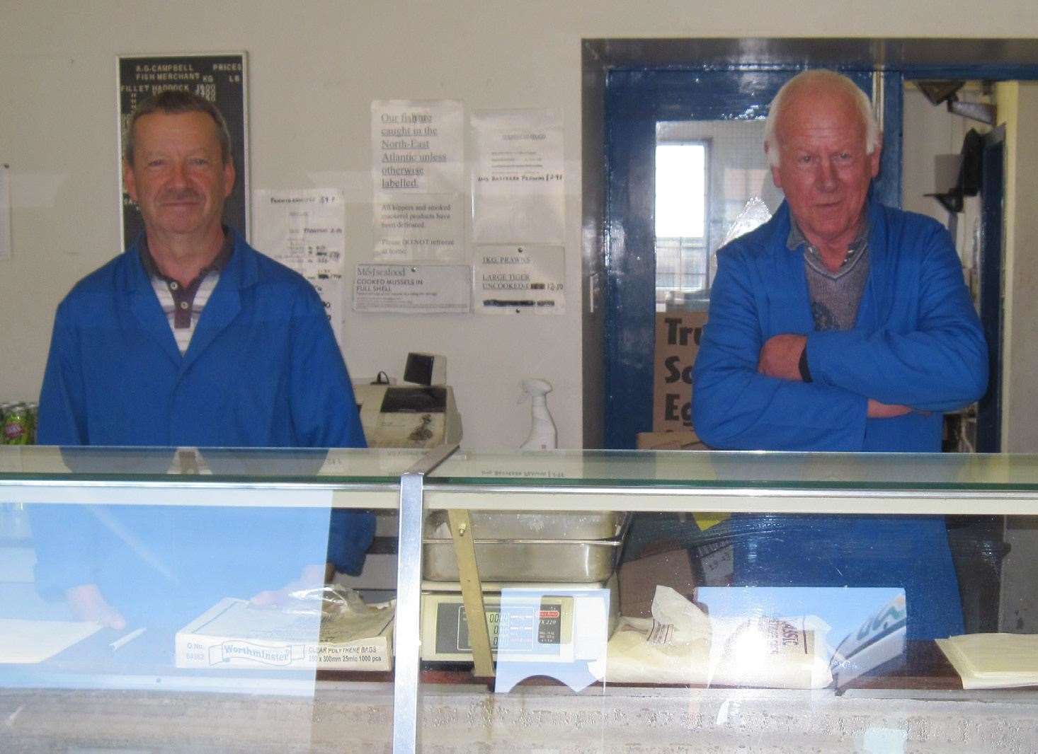 Hamish Campbell in 2020 behind the counter at A G Campbell fish merchants with business owner the late Sandy Campbell.