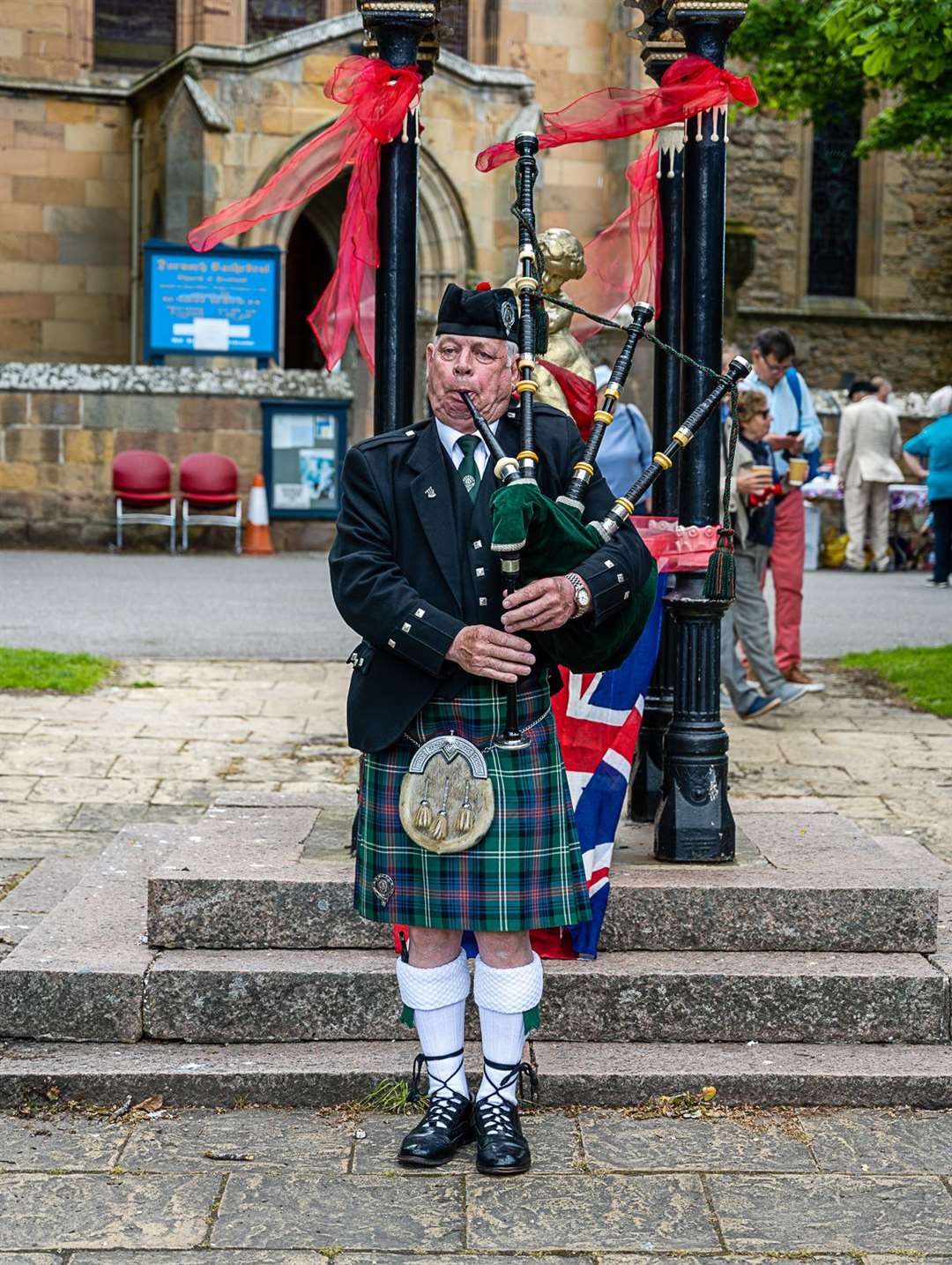 Pipe Major Willie Fraser, Dornoch Pipe Band, announces the party is about to start. Picture: Andy Kirby