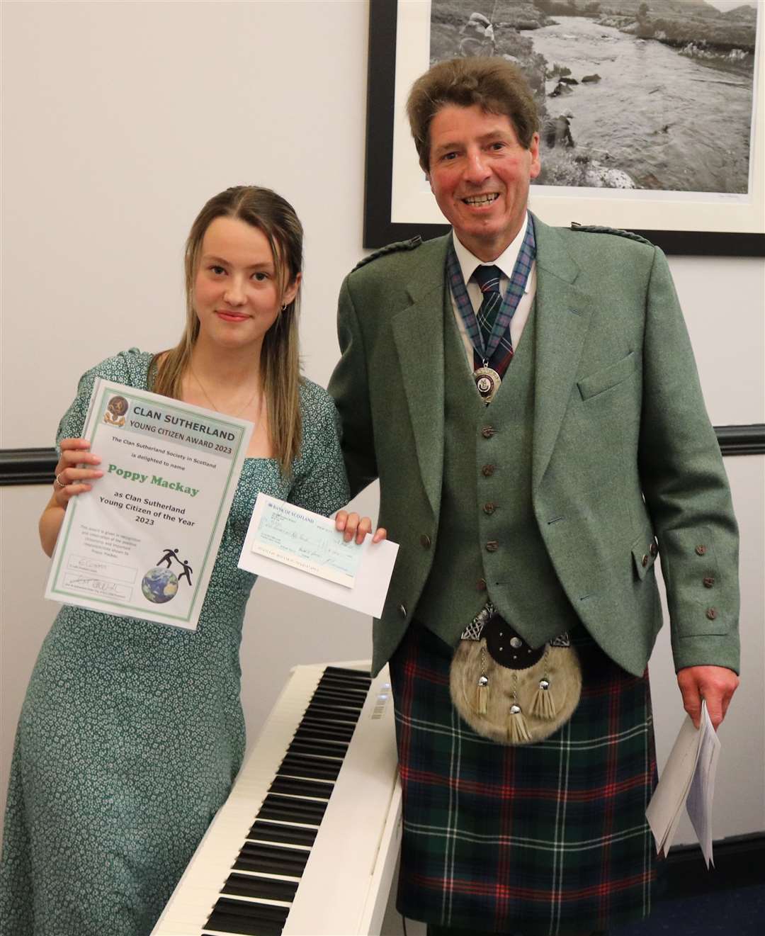 Mark Sutherland-Fisher presented Poppy Mackay with the award at dinner held as part of the Clan Sutherland Gathering. Picture: Bryce Sutherland