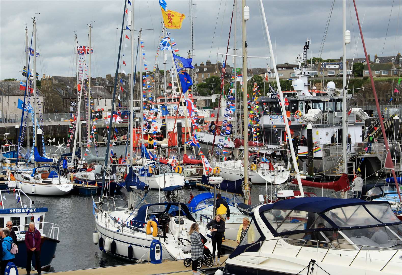 Boats in the Wick marina decked out in colourful bunting for the occasion. Picture: Alan Hendry