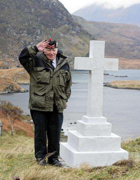 Willie Elliot salutes his fallen uncles at the Glencoul war memorial which is the remotest in the UK. The memorial’s restoration was paid for by the Duke of Westminster. Picture: Peter Jolly