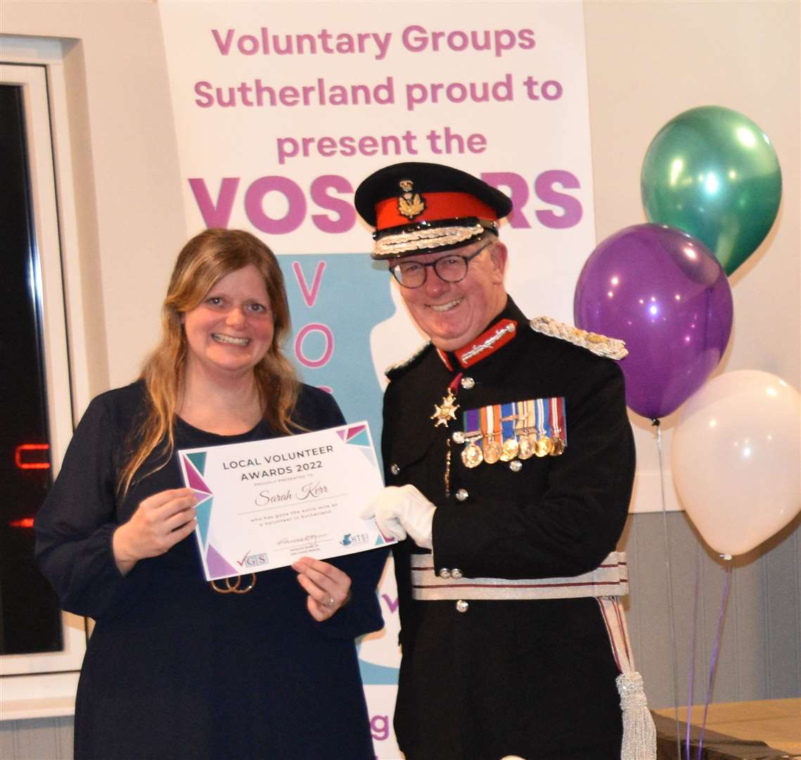 Volunteer Sarah Kerr, Portskerra, received her award from Major General Patrick Marriott.