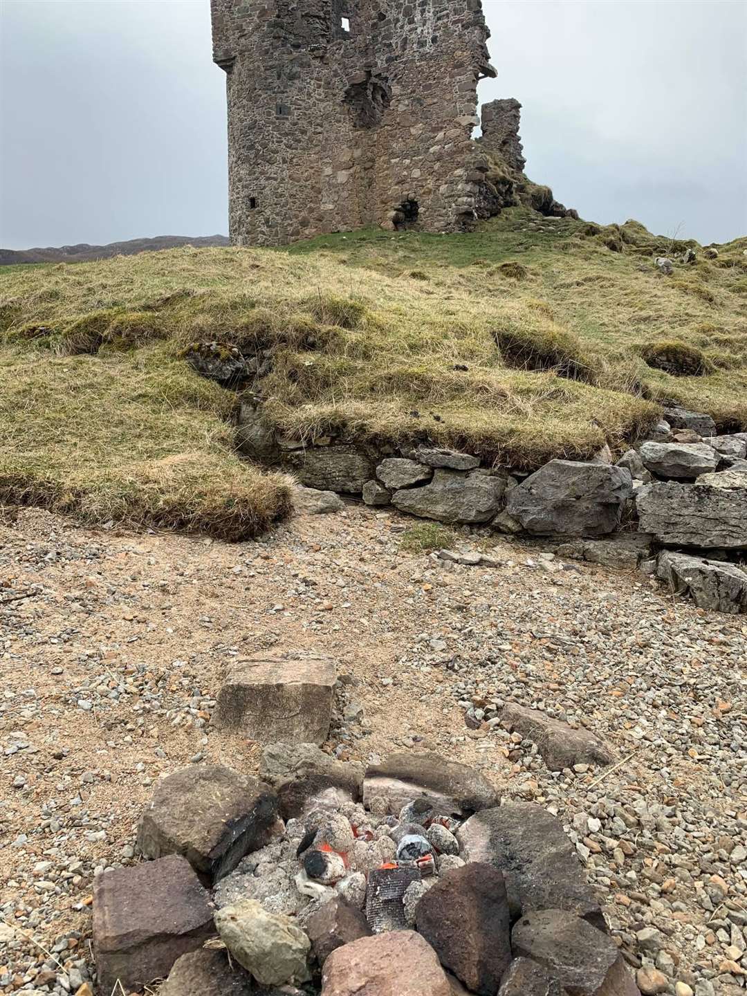 A fire lit by wild campers in 2020 just a stone's throw away from the 16th century Ardvreck Castle. Picture: Jane Mackenzie for The Land Weeps