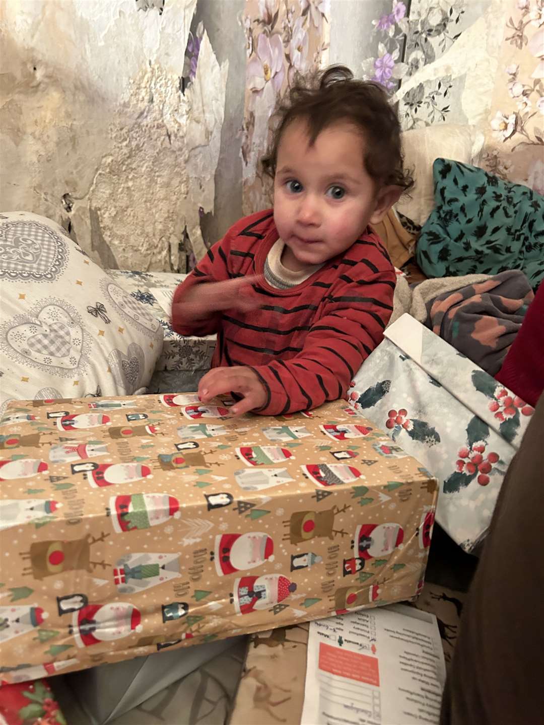 Sliven, Bulgaria, 9 December 2023: a Roma child joins in the excitement as Blythswoodshoeboxes are distributed
