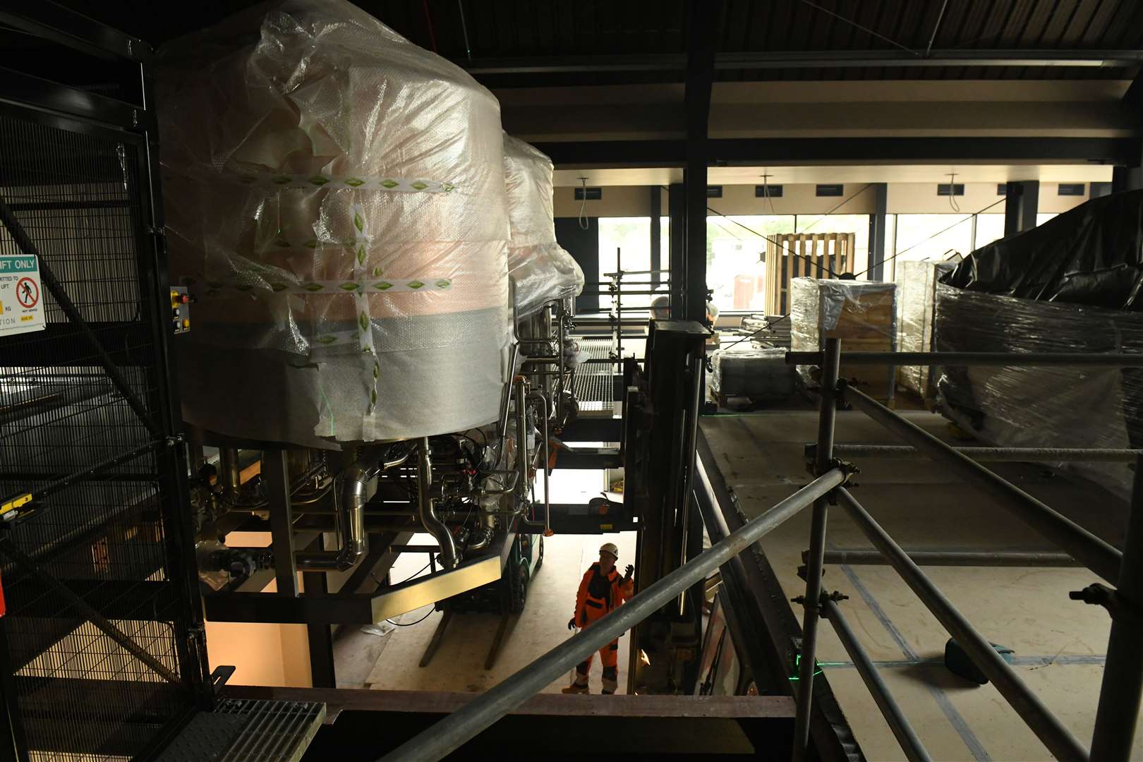 The brewery bing lifted up through the floor using a fork lift. Picture: James Mackenzie.