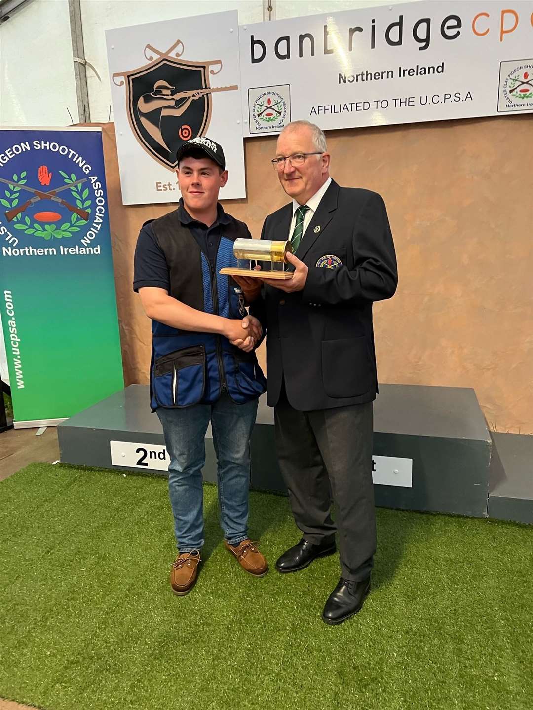 Hamish is presented with the prestigious Caledonian Cartridge trophy by the president of Banbridge Shooting Ground. The trophy was awarded for High Junior for Scotland at the British Open.