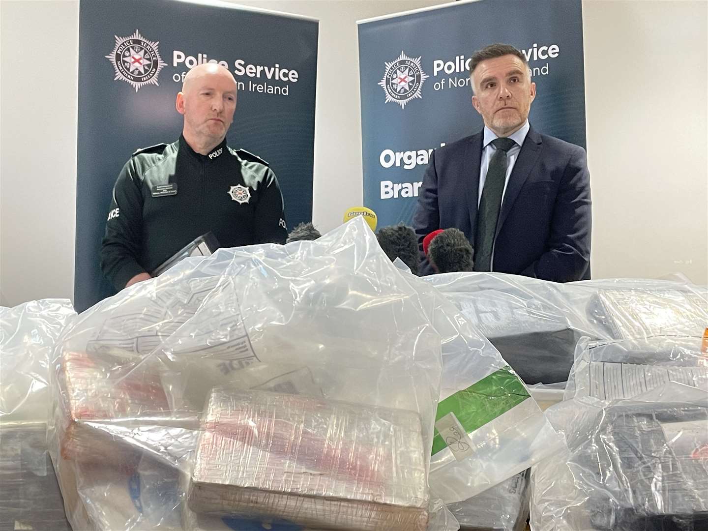 Newry, Mourne & Down District Commander Superintendent Norman Haslett (left) and Detective Chief Superintendent Andy Hill with a quantity of suspected cocaine seized in Co Armagh on Monday night (Rebecca Black/PA)