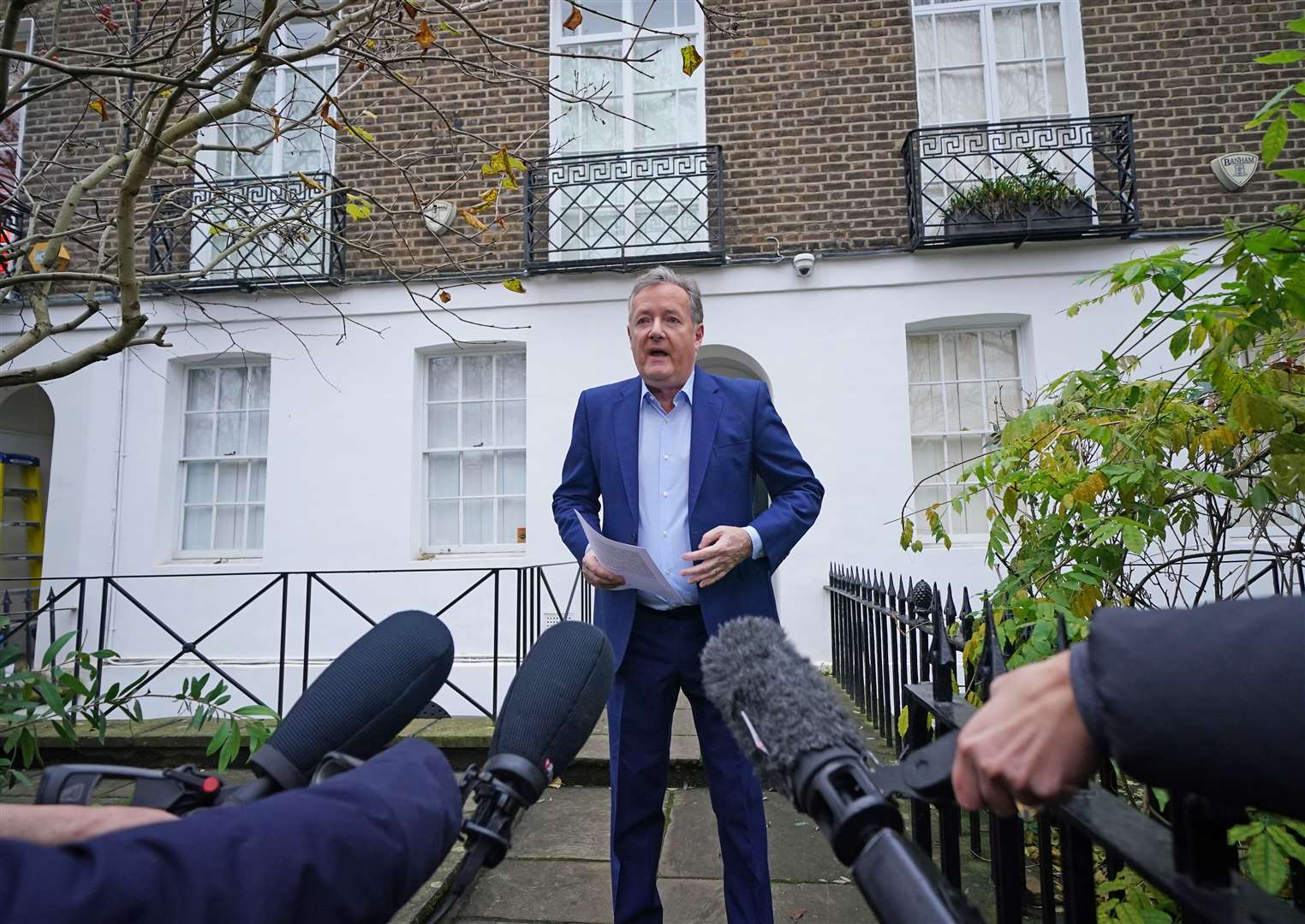 Piers Morgan speaking to the media outside his home (Yui Mok/PA)