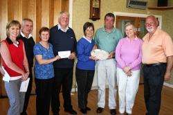 SSPCA mixed foursome winners at Brora (L-R): Angela and Alister Sutherland; Angela MacBeath, the Brora lady captain presenting Sutherland branch chairman of the SSPCA Bill Fassen de Heer with a donation; winners Pat and Shaun Ashe; Sally Ross and Ken Lori