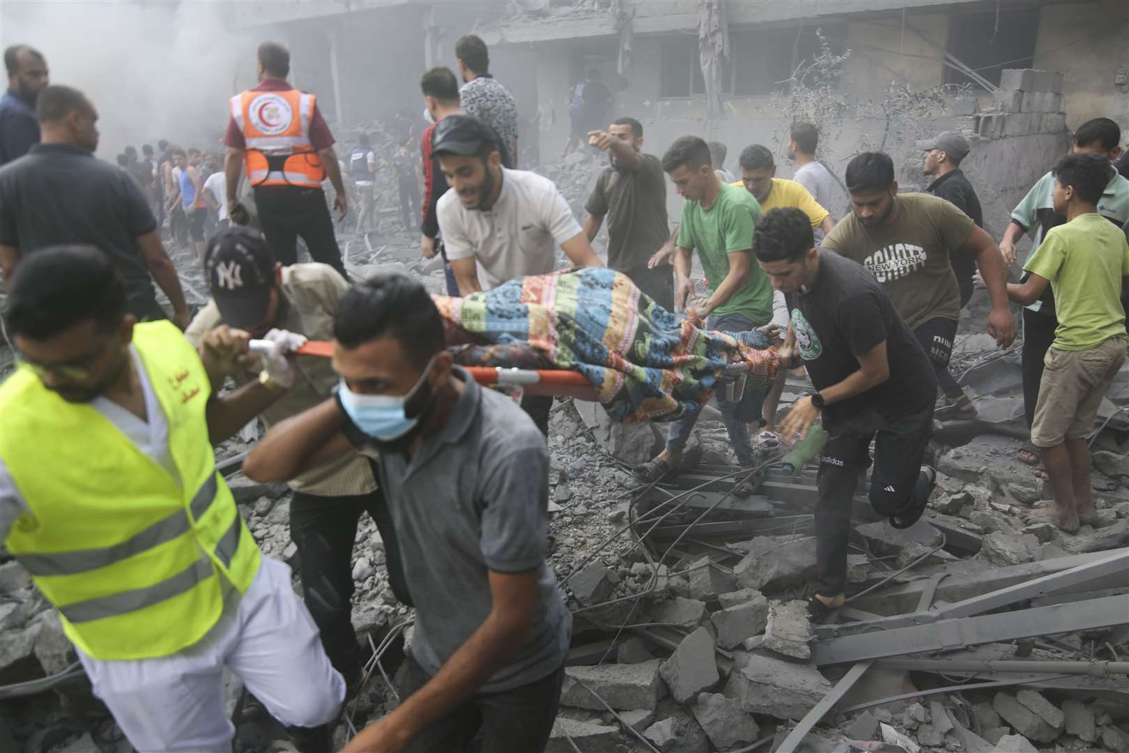 Palestinians evacuate the wounded after an Israeli airstrike in Rafah refugee camp (Hatem Ali/AP/PA)